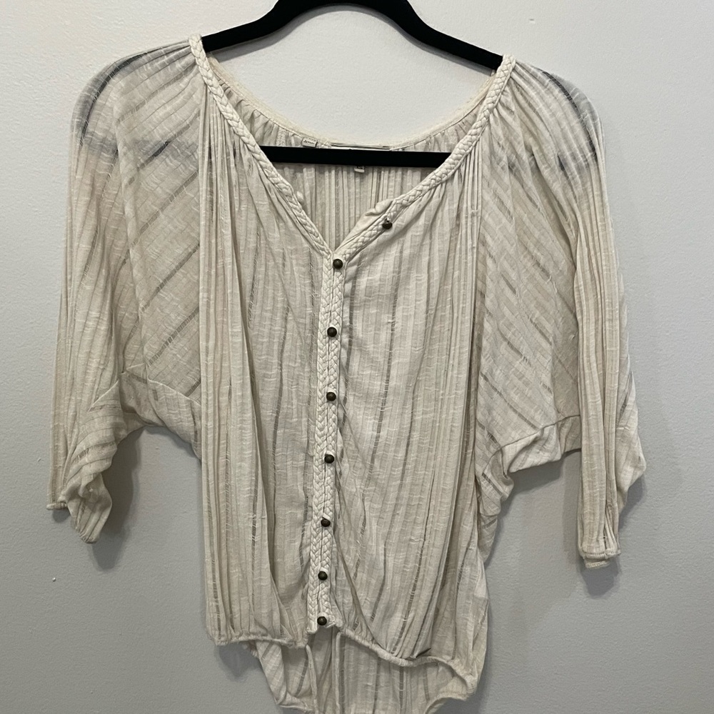 Beige top, sheer.